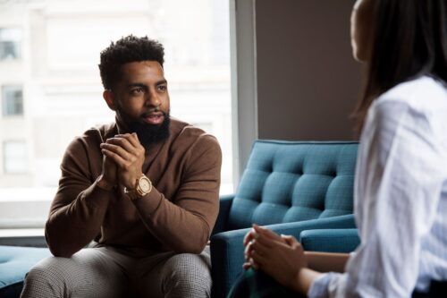 man asking questions about therapy to a new therapist