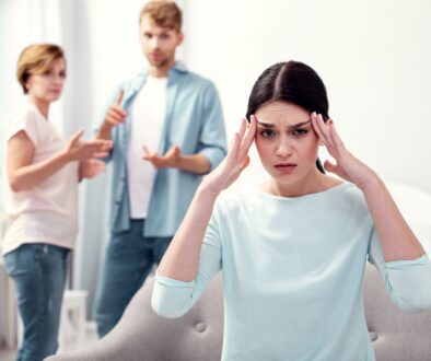 stressed woman surrounded by her toxic family_needs family counseling